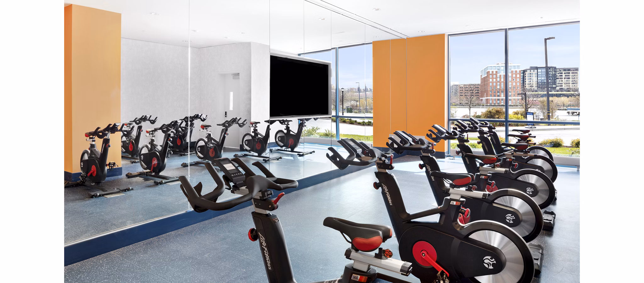 Modern fitness center with top-tier equipment at Hamilton Cove Apartments in luxury Greystar community