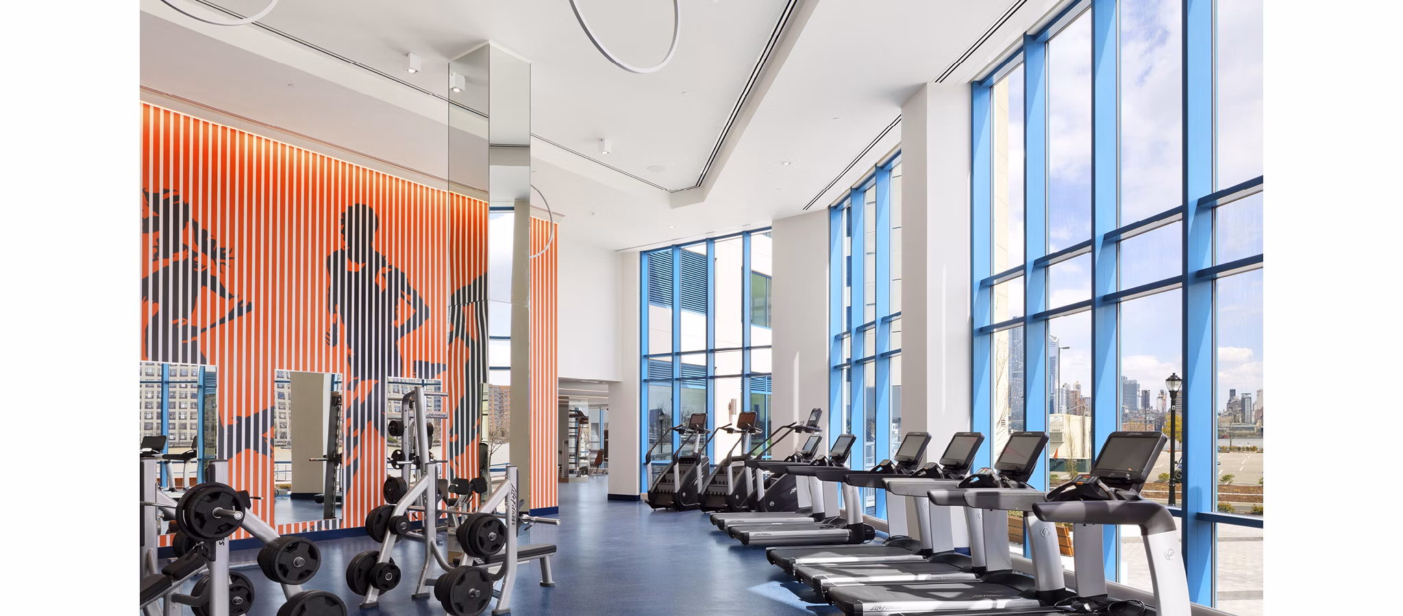 State-of-the-art fitness center at Hamilton Cove Apartments with cardio and strength training equipment, promoting a healthy lifestyle for residents