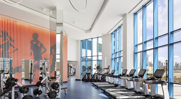 State-of-the-art fitness center at Hamilton Cove Apartments with cardio and strength training equipment, promoting a healthy lifestyle for residents