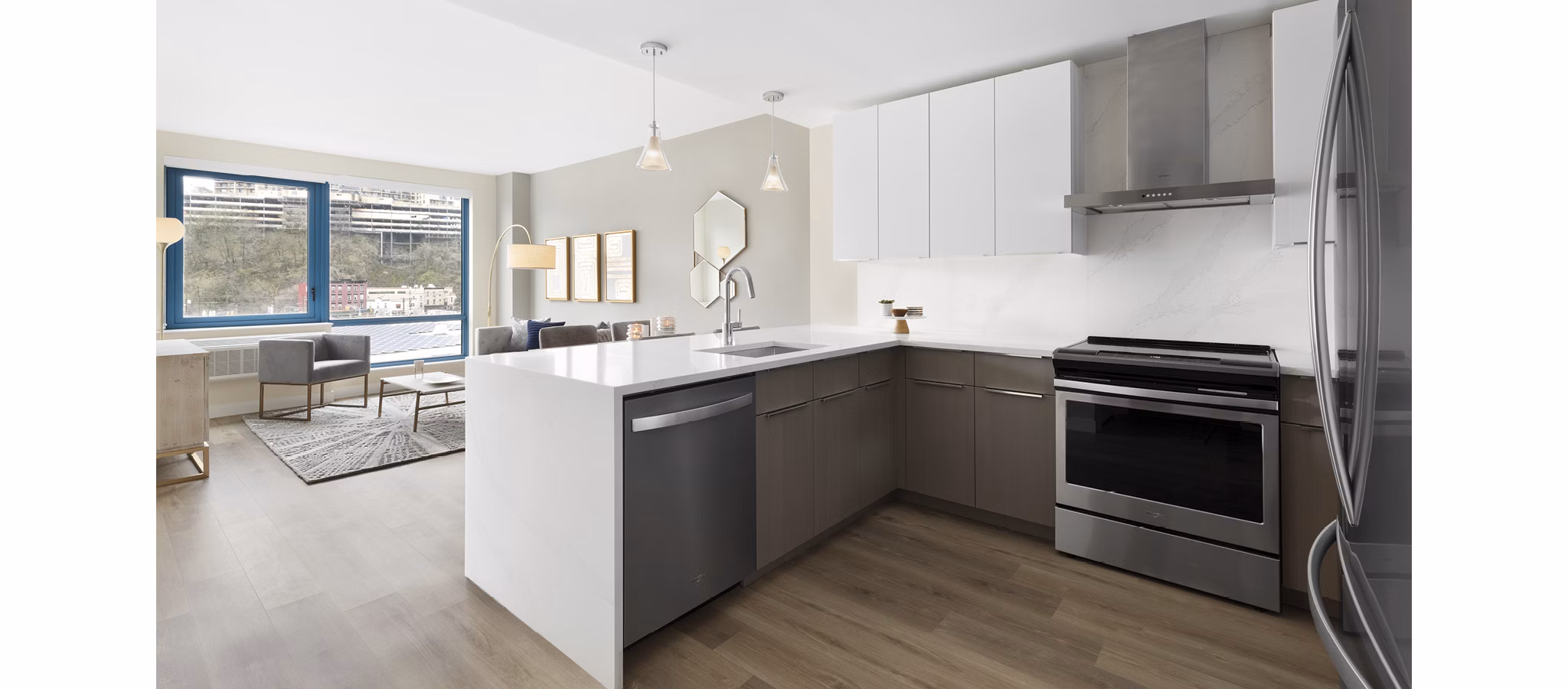 Modern kitchen with stainless steel appliances at Hamilton Cove Apartments