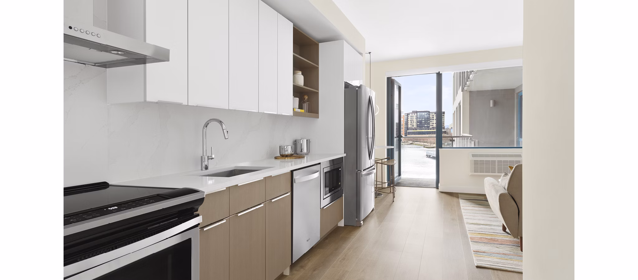 Modern kitchen with stainless steel appliances in Hamilton Cove Apartments