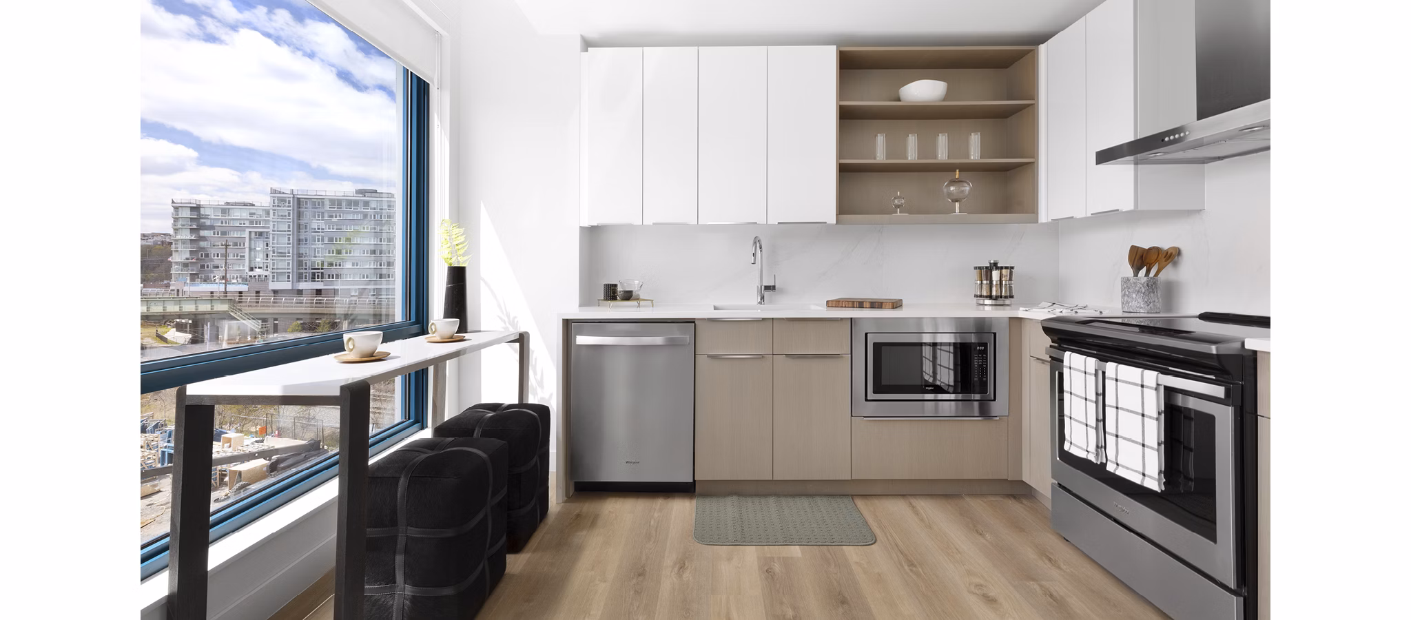 Modern kitchen featuring stainless steel appliances at Hamilton Cove Apartments