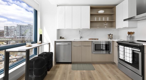 Modern kitchen featuring stainless steel appliances at Hamilton Cove Apartments