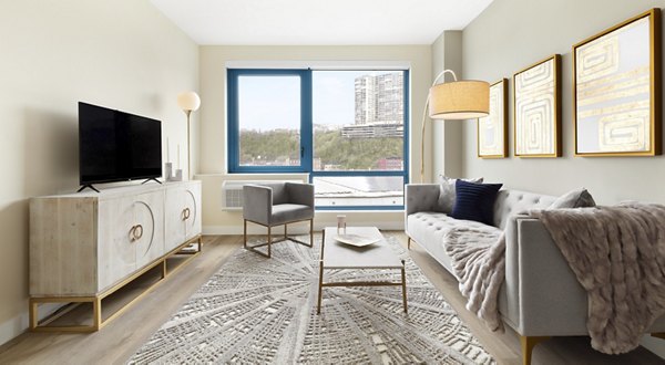 Living room with modern dÃ©cor and natural light at Hamilton Cove Apartments