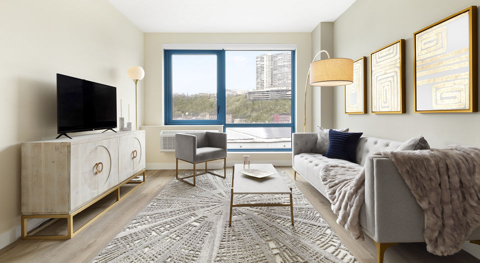 Living room with modern dÃ©cor and natural light at Hamilton Cove Apartments