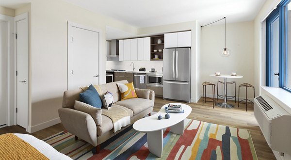 Living room with stylish furnishings and natural light at Hamilton Cove Apartments