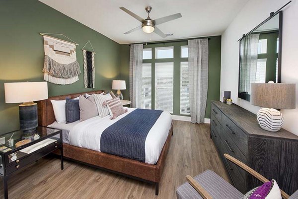 Cozy bedroom with modern decor at The Penrose Apartments