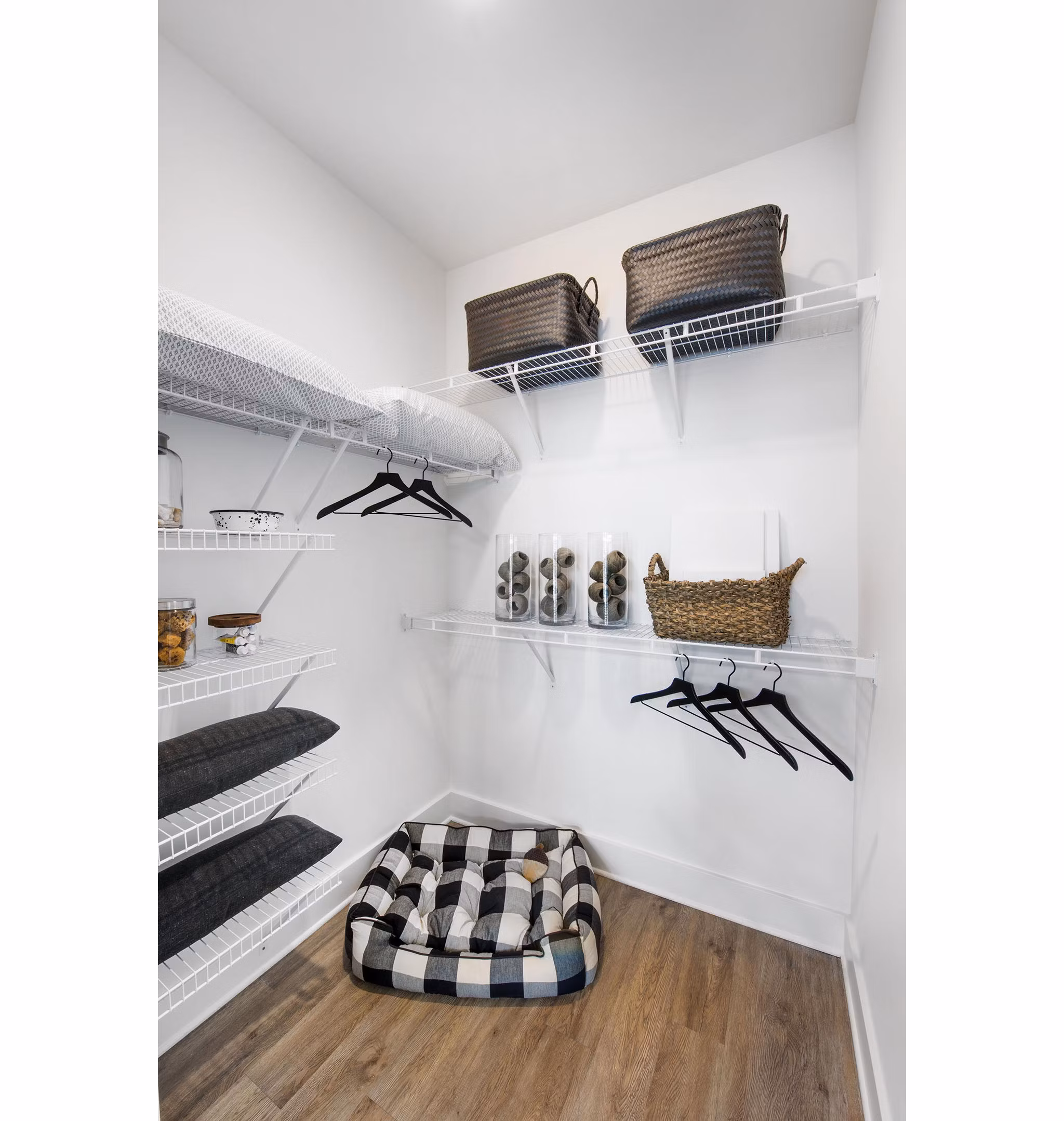 Walk-in closet with custom shelving in The Penrose Apartments