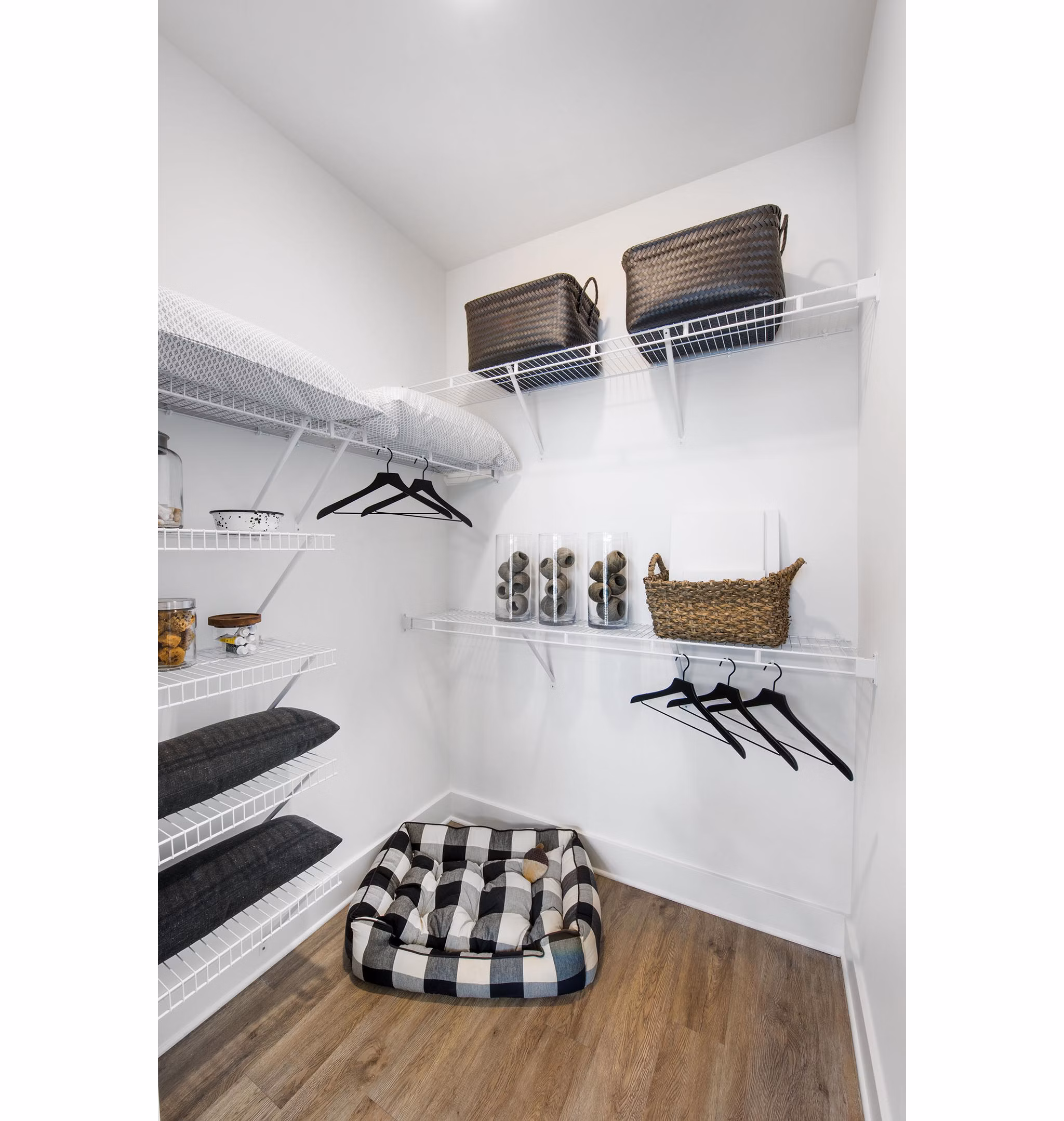 Walk-in closet with custom shelving in The Penrose Apartments