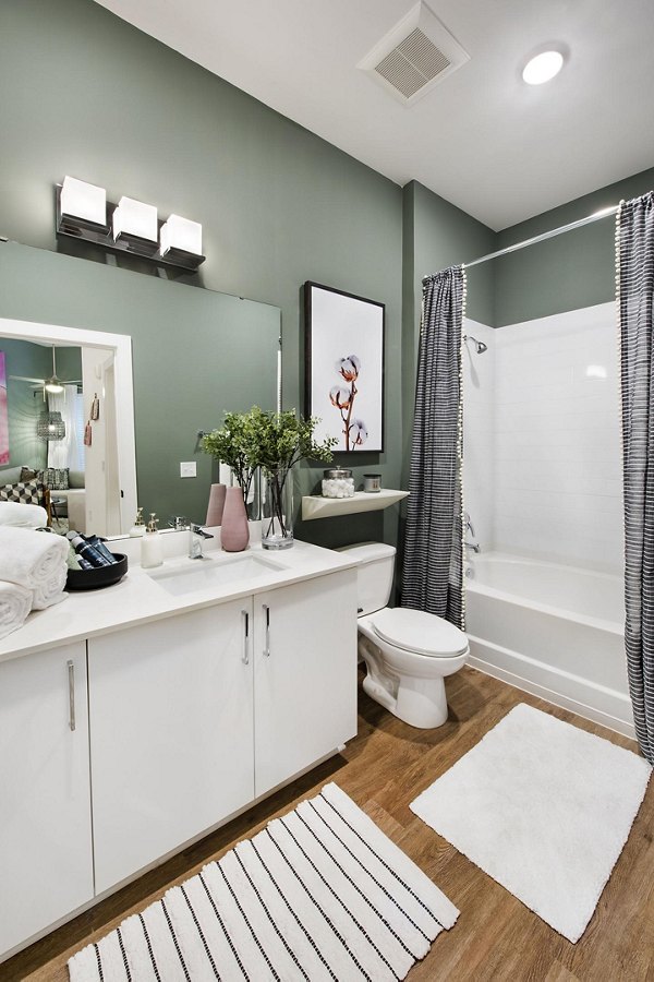 Modern bathroom with sleek fixtures at The Penrose Apartments providing luxury living amenities