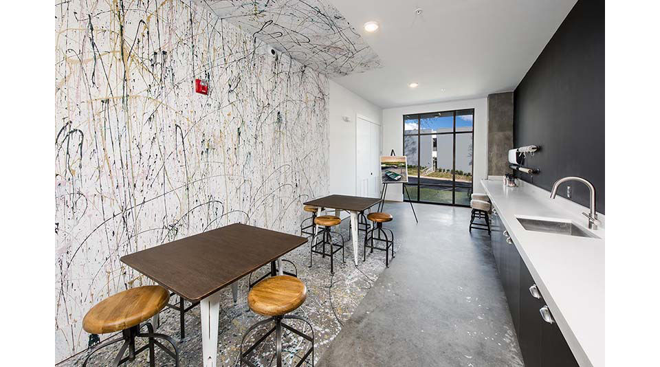 Clubhouse featuring modern design and upscale amenities at The Penrose Apartments, Greystar luxury living