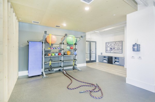 Fitness center with modern equipment at The Penrose Apartments for active lifestyle enthusiasts