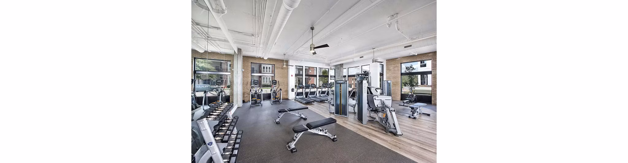 The Penrose Apartments: State-of-the-art fitness center featuring modern equipment