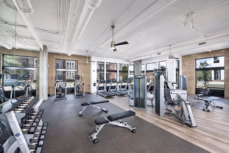 The Penrose Apartments: State-of-the-art fitness center featuring modern equipment