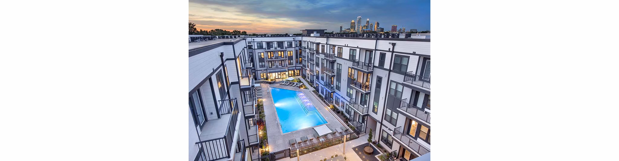 Rooftop pool with stunning city views at The Penrose Apartments, a Greystar property