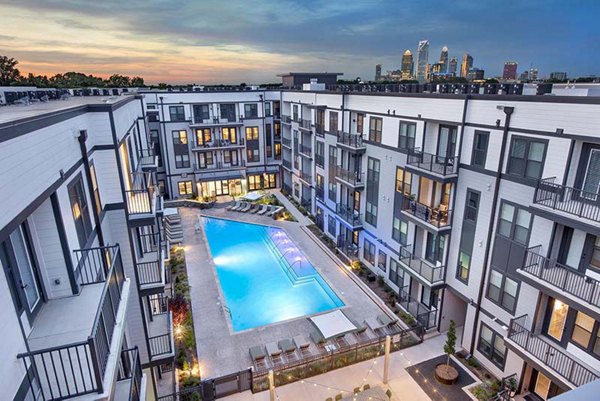 Rooftop pool with stunning city views at The Penrose Apartments, a Greystar property