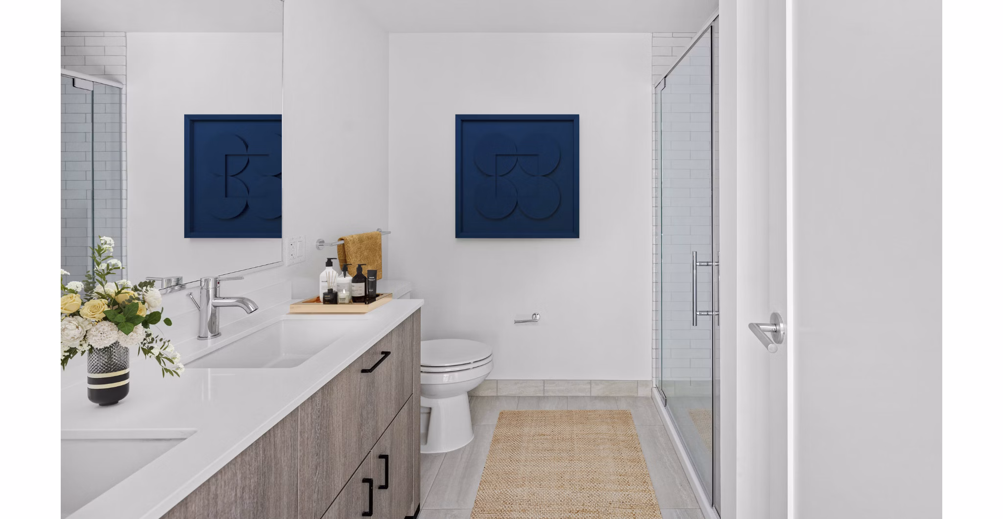 Elegant bathroom with marble countertops and modern fixtures at The Smith Apartments luxury living