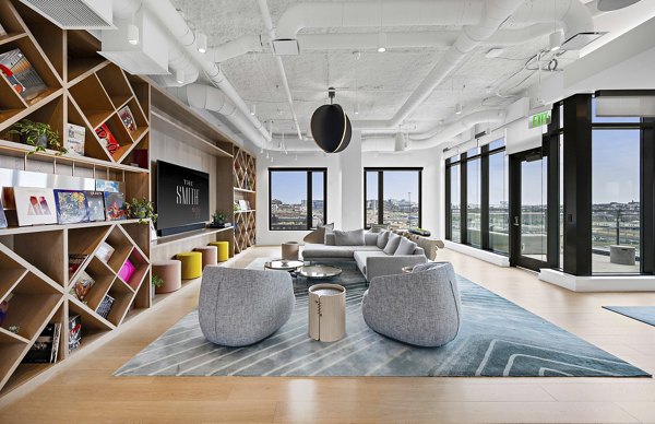 Clubhouse featuring modern furniture and game tables at The Smith luxury apartments in downtown Seattle