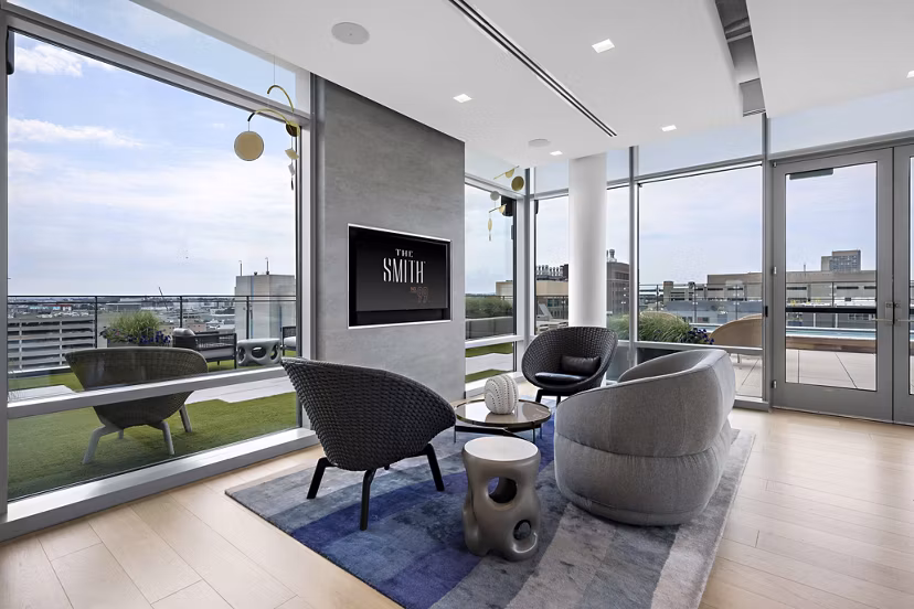 Spacious clubhouse with modern decor at The Smith Apartments, perfect for luxury gatherings and community events