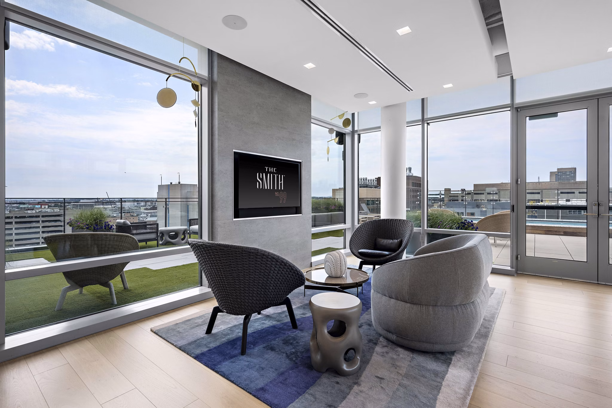 Spacious clubhouse with modern decor at The Smith Apartments, perfect for luxury gatherings and community events