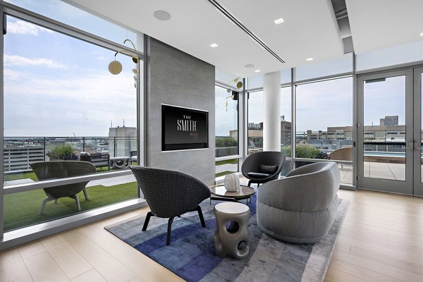 Spacious clubhouse with modern decor at The Smith Apartments, perfect for luxury gatherings and community events