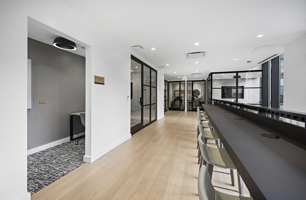 The Smith Apartments: Modern clubhouse featuring a spacious lounge and seating areas