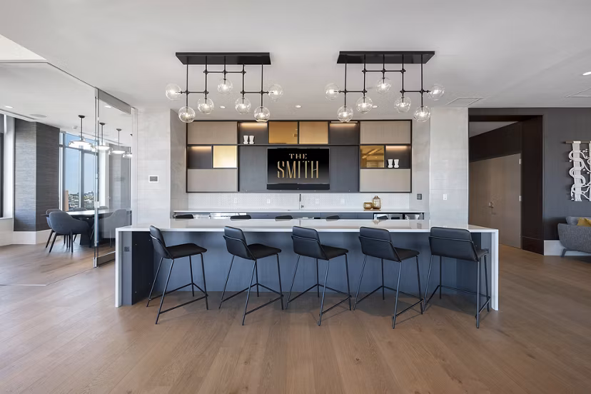 Modern clubhouse featuring stylish decor and ample seating at The Smith Apartments