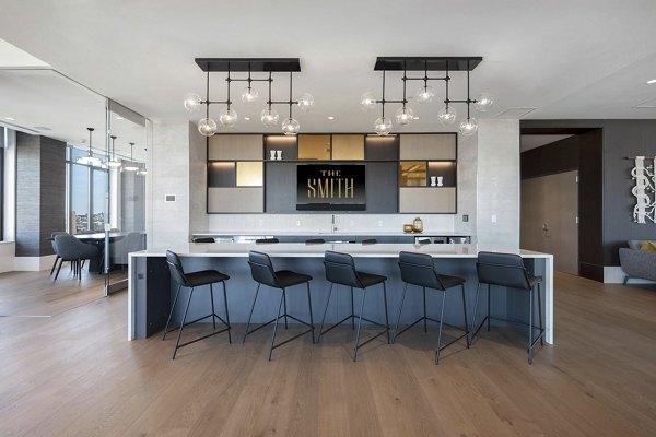 Modern clubhouse featuring stylish decor and ample seating at The Smith Apartments