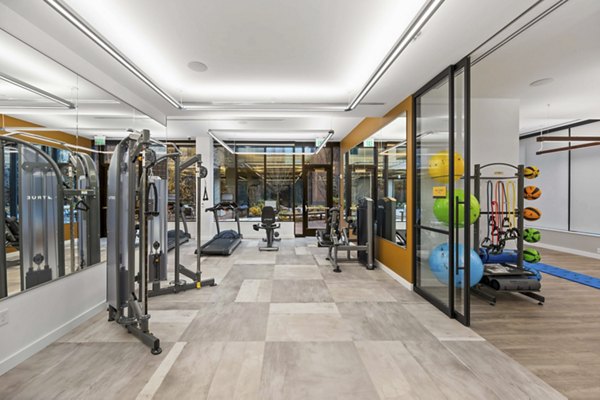 State-of-the-art fitness center with modern equipment at The Smith Apartments, luxury community living in prime location
