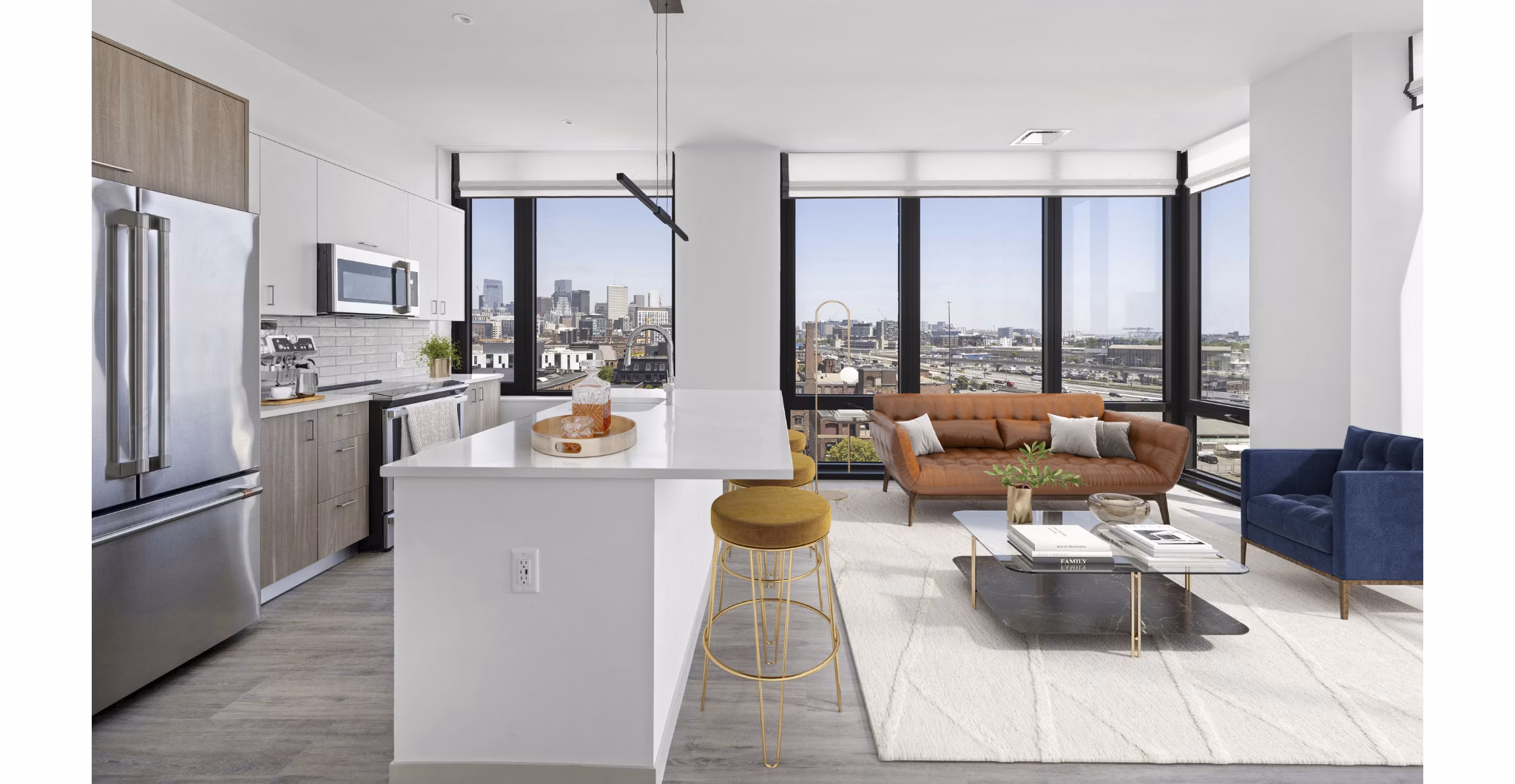 Contemporary living room with stylish decor and large windows in The Smith Apartments