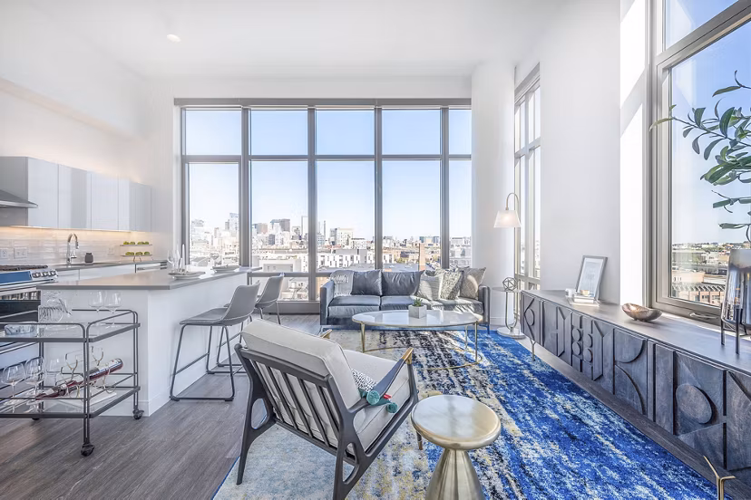 Spacious living room with modern decor at The Smith Apartments