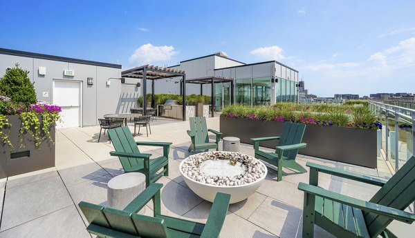 Fire pit on spacious patio at The Smith Apartments, offering luxurious outdoor living spaces in a prime location