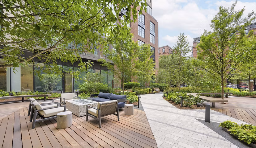 Fire pit in cozy courtyard at The Smith Apartments: Luxury retreat in a Greystar community