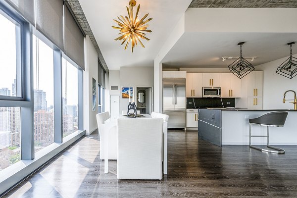 Elegant dining room with modern furnishings in Imprint Apartments