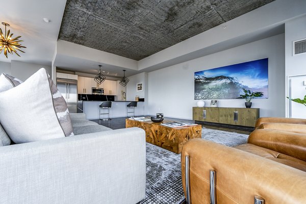 Spacious living room with modern furnishings at Imprint Apartments