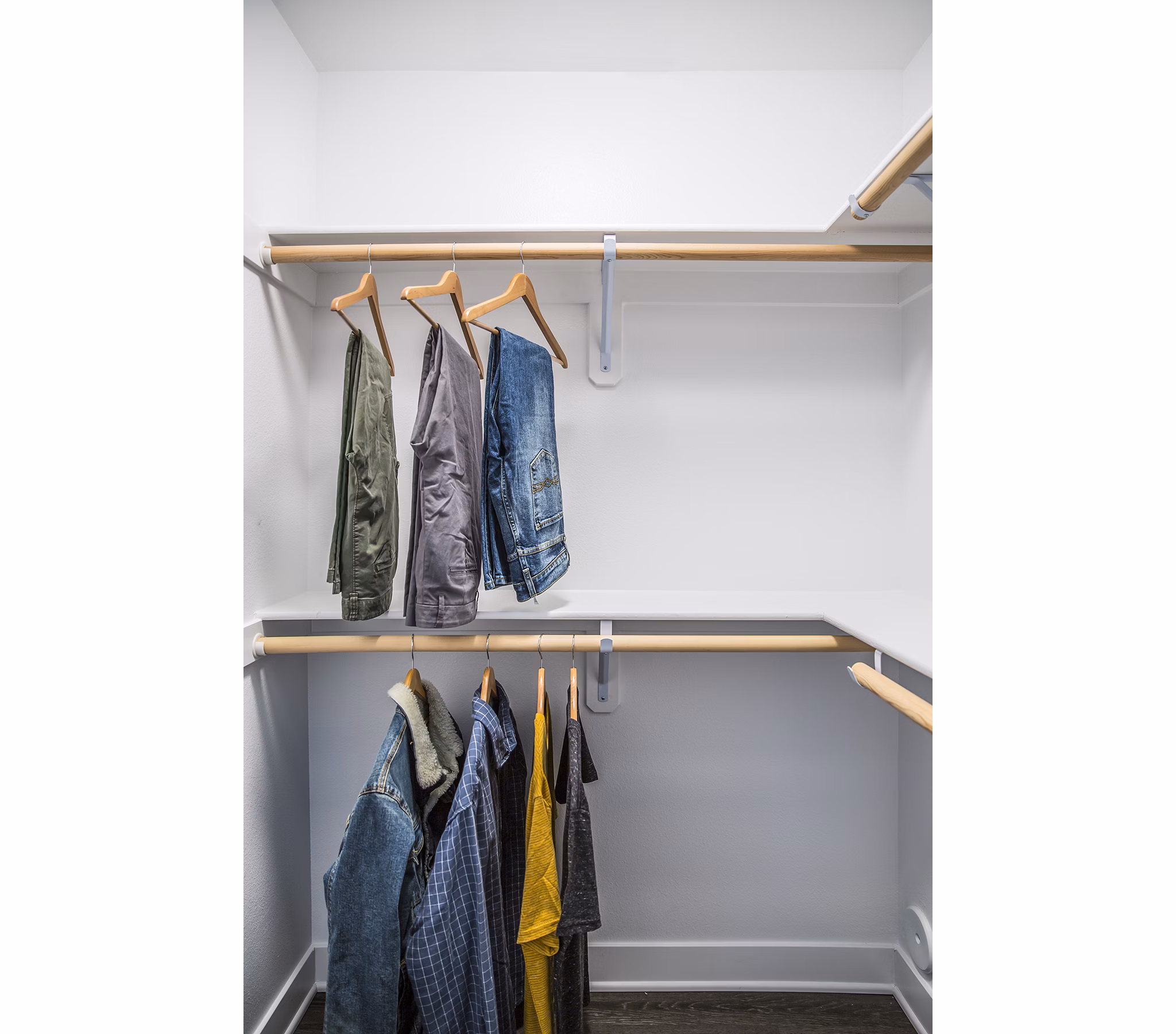 Walk-in closet with ample storage space at The Griffith Apartments, a luxury community in Los Angeles
