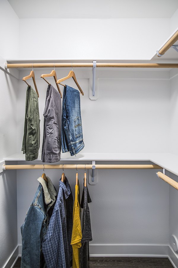 Walk-in closet with ample storage space at The Griffith Apartments, a luxury community in Los Angeles