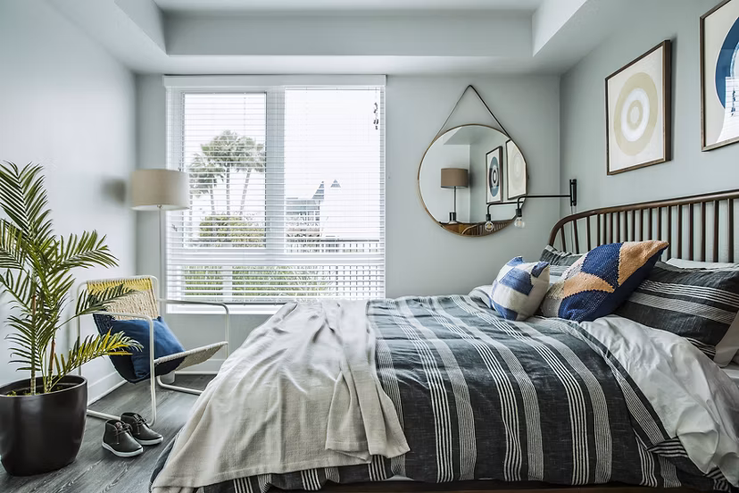 Cozy bedroom with stylish decor at The Griffith Apartments: Luxury living in city center
