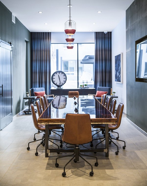 The Griffith Apartments: Modern meeting facility with sleek design and ample seating in a luxury setting