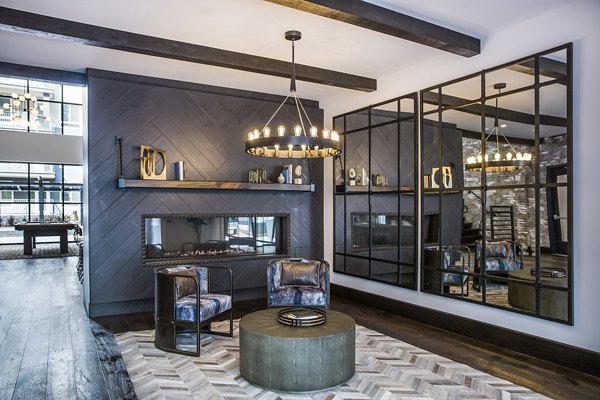 Clubhouse featuring modern design and seating areas at The Griffith Apartments