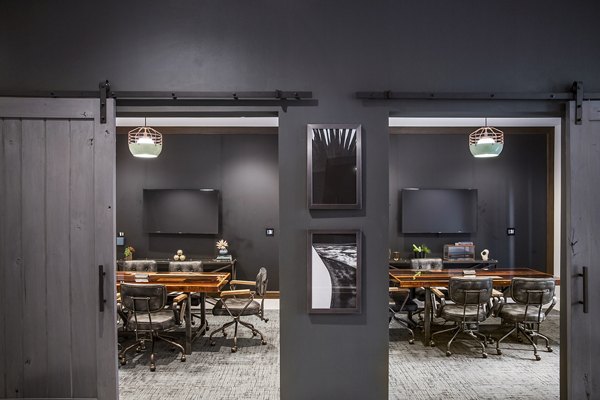 Meeting room with state-of-the-art equipment at The Griffith Apartments, ideal for business gatherings and conferences