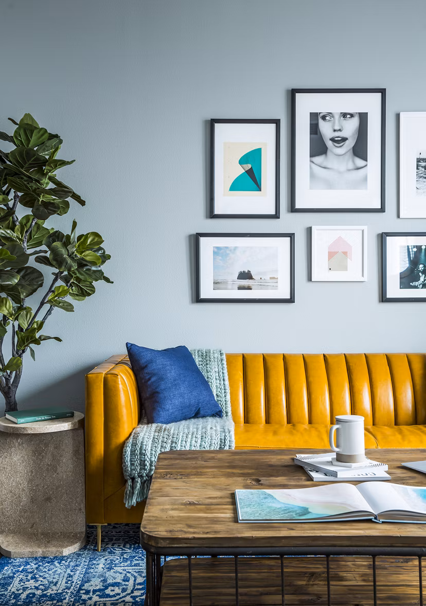 Modern living room with sleek furnishings and open layout at The Griffith Apartments