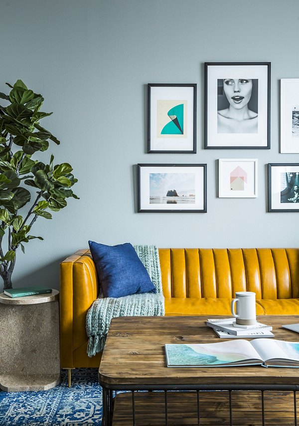 Modern living room with sleek furnishings and open layout at The Griffith Apartments