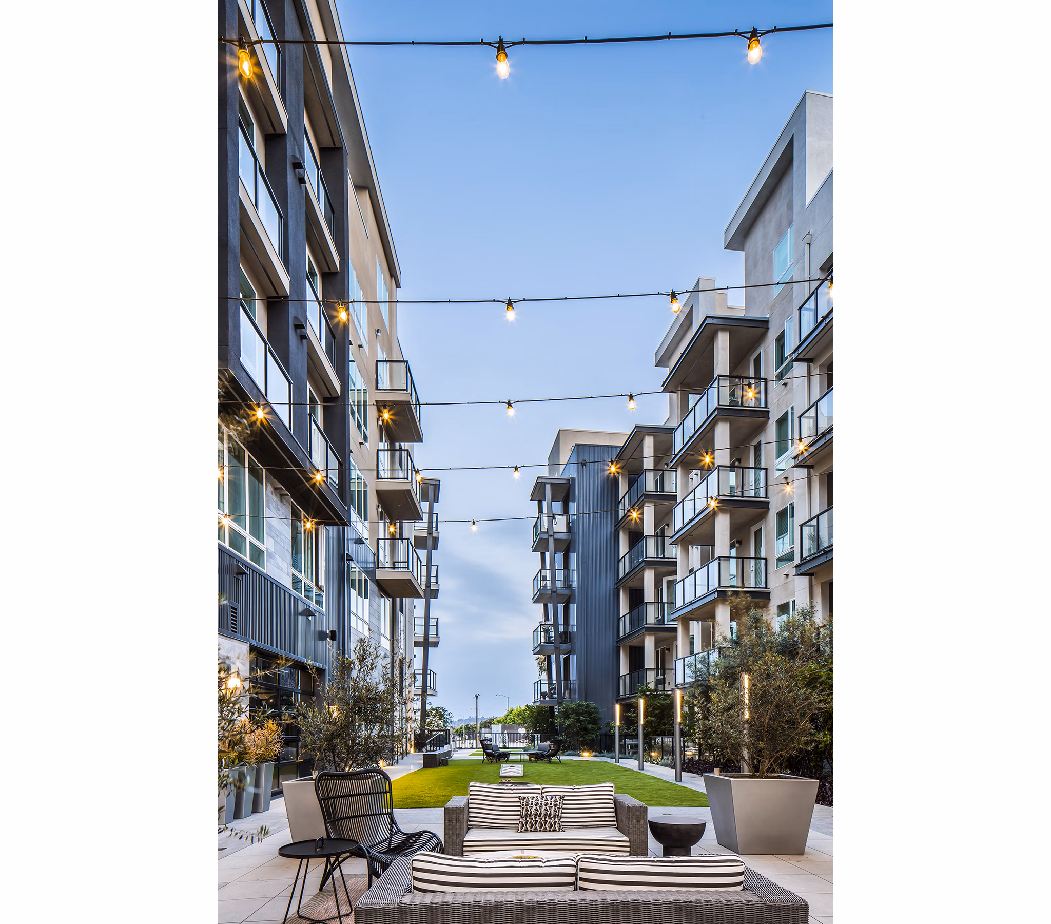 Outdoor sport court at The Griffith Apartments offering residents space for basketball and tennis activities