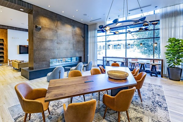 The Asher Apartments: Clubhouse lobby featuring modern design and comfortable seating