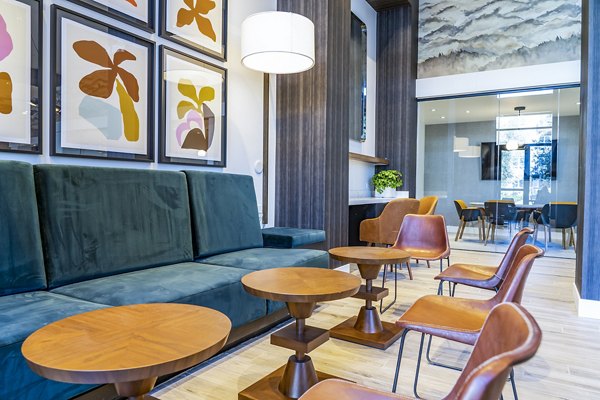 The Asher Apartments: Elegant clubhouse lobby featuring modern decor and seating areas