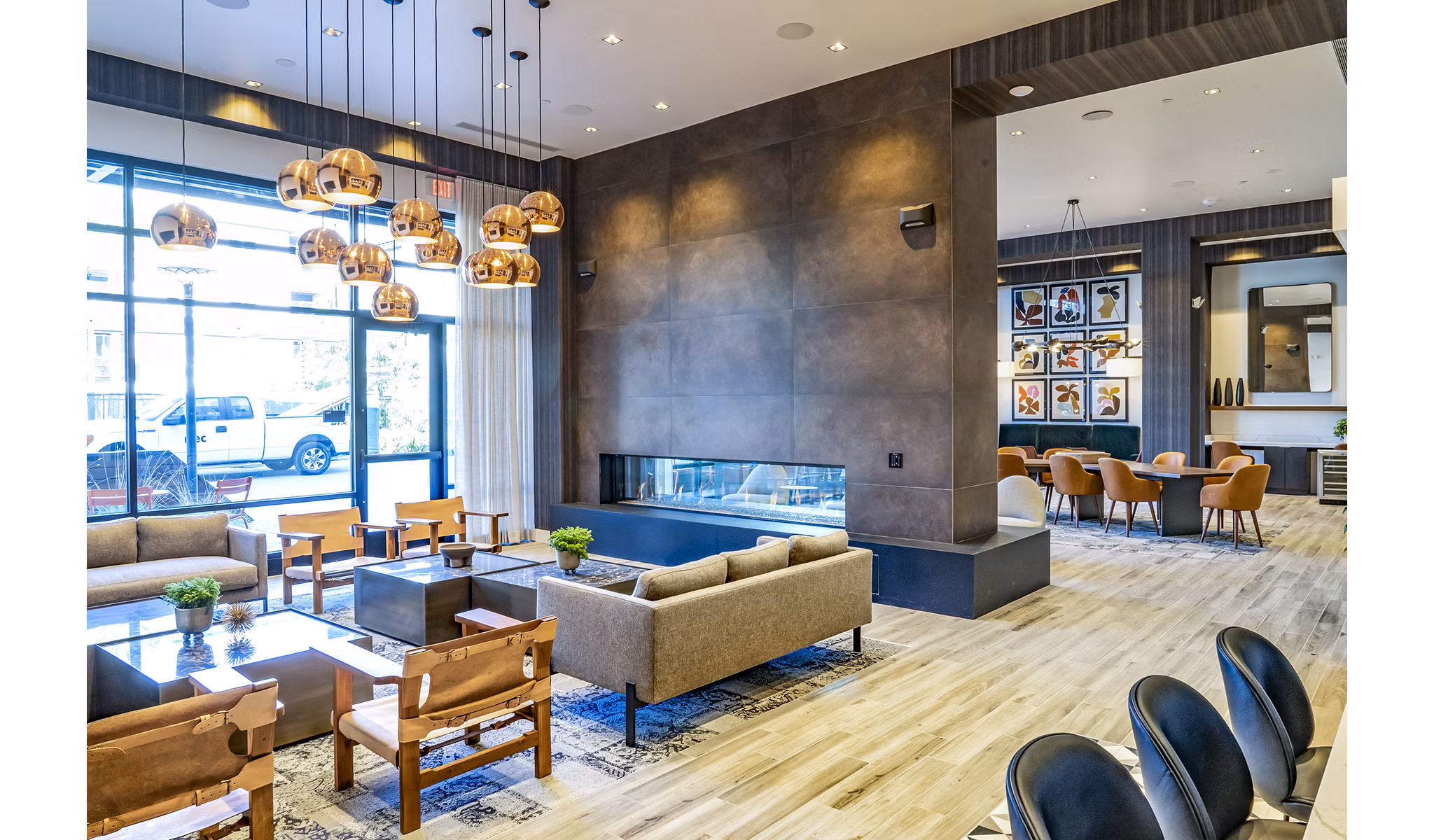 The Asher Apartments: Stylish clubhouse lobby with modern furnishings and natural light