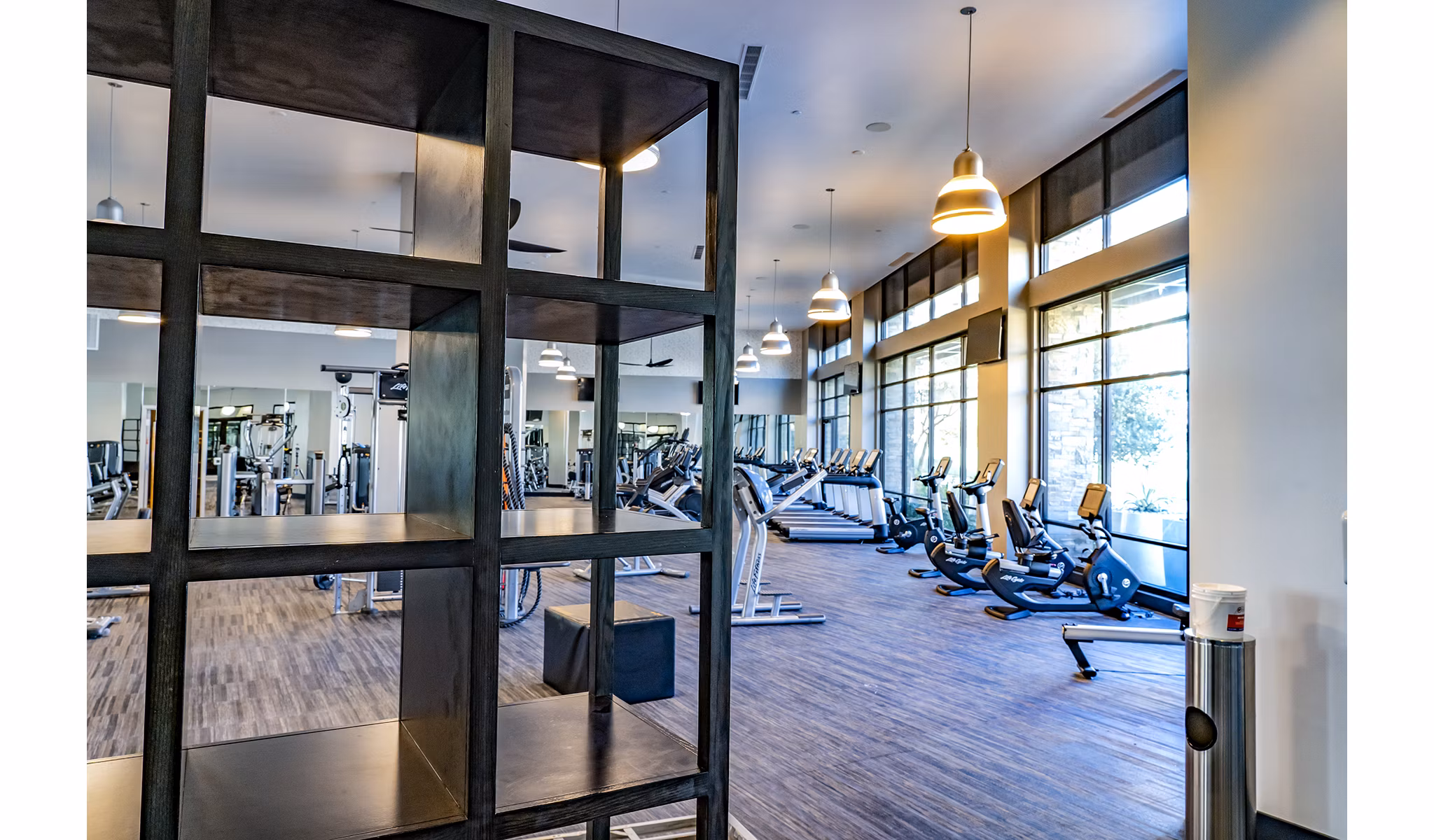 State-of-the-art fitness center featuring modern equipment at The Asher Apartments, managed by Greystar