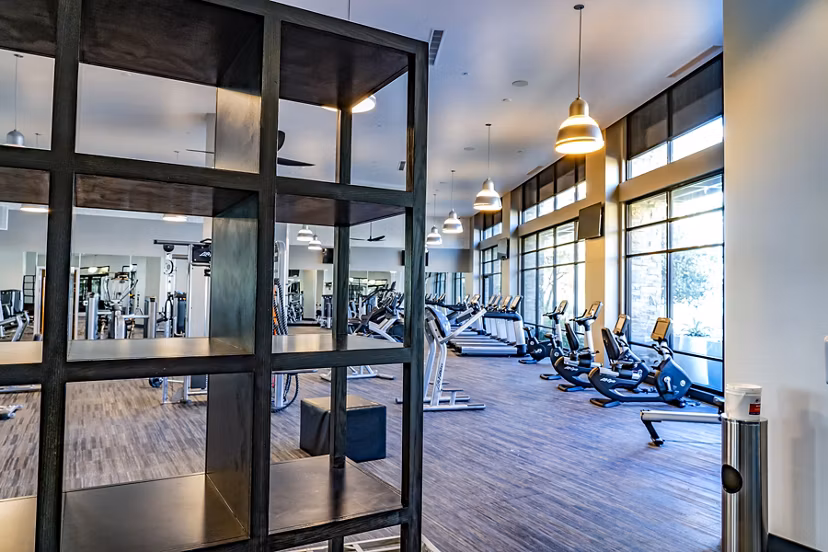 State-of-the-art fitness center featuring modern equipment at The Asher Apartments, managed by Greystar