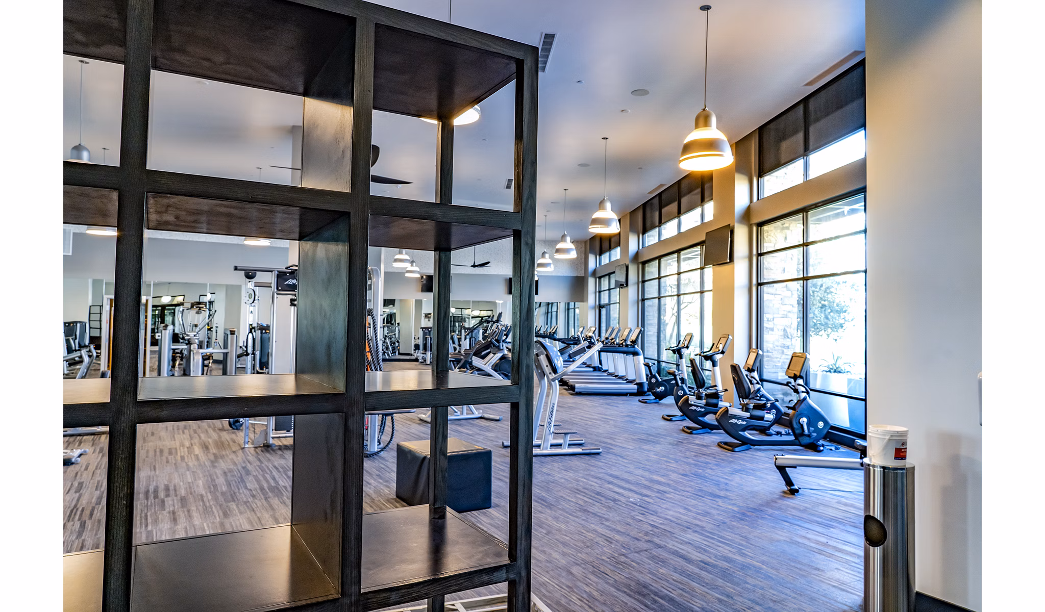 State-of-the-art fitness center featuring modern equipment at The Asher Apartments, managed by Greystar